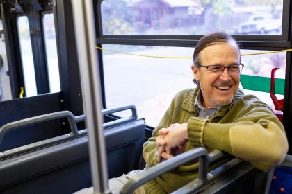 man riding bus